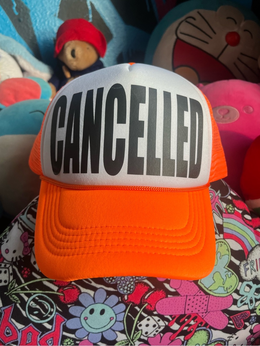 CANCELLED neon orange trucker cap